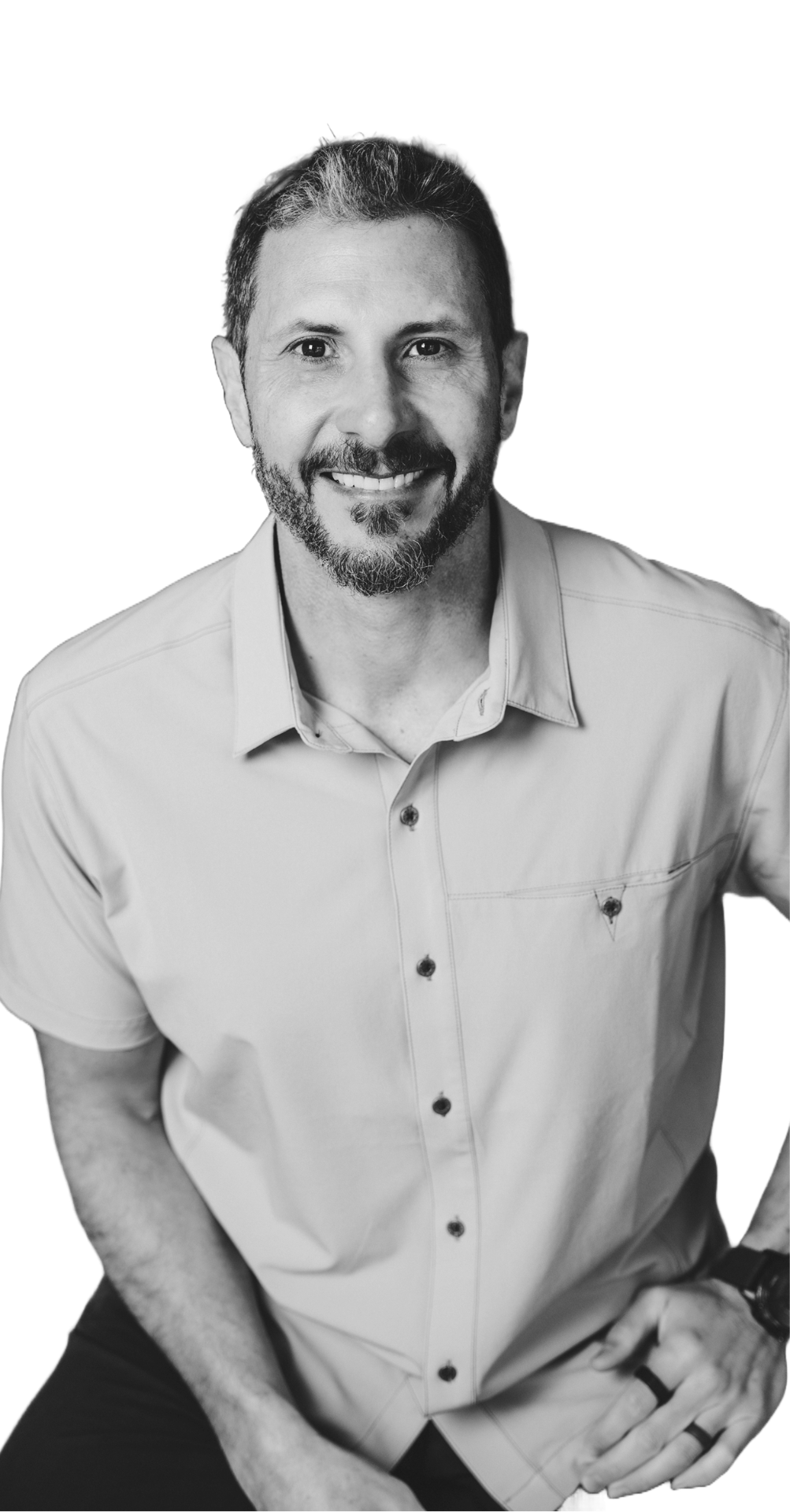 Eric Malzone studio portrait in monochrome, smiling